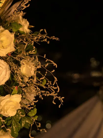 Detail of the white rose arrangements. I believe in using high quality floral designs to add a touch of classic elegance and romance to your milestone event.