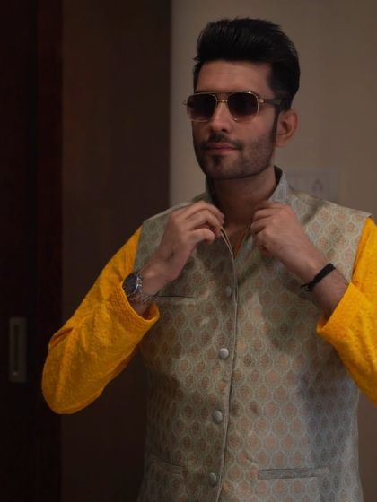 Another shot of my pre-event routine, ensuring every detail of my attire is impeccable.