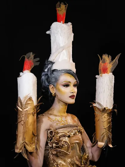 I encourage you to push the boundaries of creativity. This look, inspired by a living candelabra, showcases advanced techniques in body art, prosthetic application, and thematic styling. This is the kind of high-concept, editorial work you will be trained to execute.
