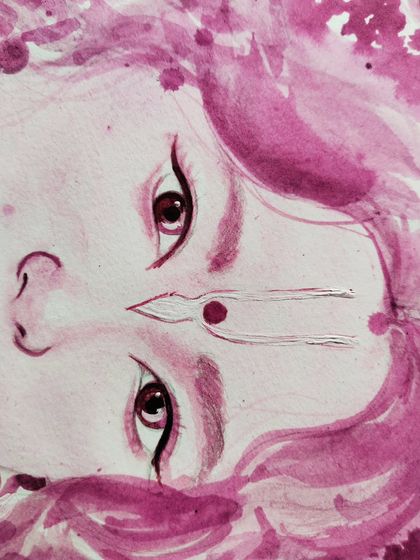 A close-up of my Kanha watercolor painting, focusing on the expressive eyes and the delicate tilak. This detailed view shows the fine brushwork and subtle color blending that gives the portrait its gentle and divine character.