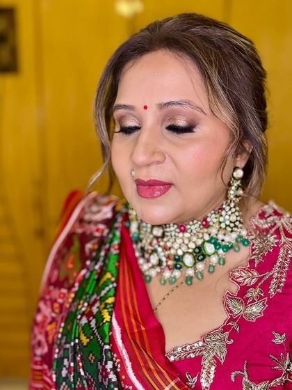A close-up of the eye makeup, showing the beautiful blend of bronze and gold shimmer. This look is perfect for adding a touch of glamour to any traditional attire.