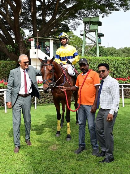 Mandarino, winner of The Leading Stud Cup, stands with jockey N. Arvind Kumar and the winning connections.