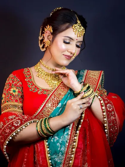 Adjusting the bangles. Every part of the bride's look is important, and I help with the full styling, including jewellery and draping.