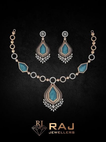 Part of our Verona Collection, this necklace features large, teardrop-shaped blue stones set within a frame of sparkling CZs. The design is classic and elegant, evoking timeless romance.