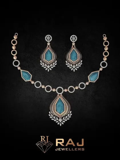 Part of our Verona Collection, this necklace features large, teardrop-shaped blue stones set within a frame of sparkling CZs. The design is classic and elegant, evoking timeless romance.