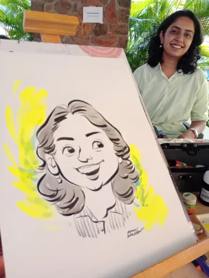 A guest poses by her finished portrait, which has a nice splash of color in the background.