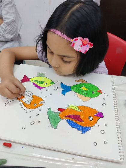 More images of our dedicated young artists at work and proudly displaying their creations.