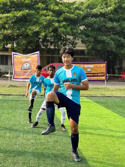 A player doing dynamic stretches, getting ready for the intensity of the tournament.