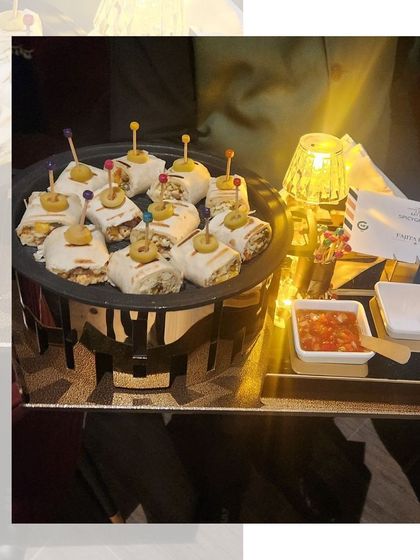 Our Fajita Bites, elegantly presented on a platter and illuminated by candlelight, making for a warm and inviting appetizer at a Diwali party.