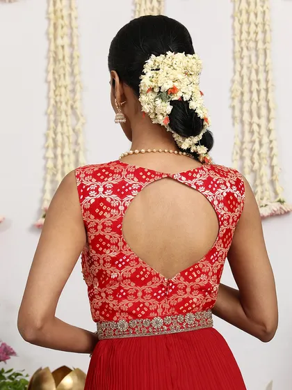 The back of the red Bandhani dress features a heart-shaped keyhole, a playful and modern detail.