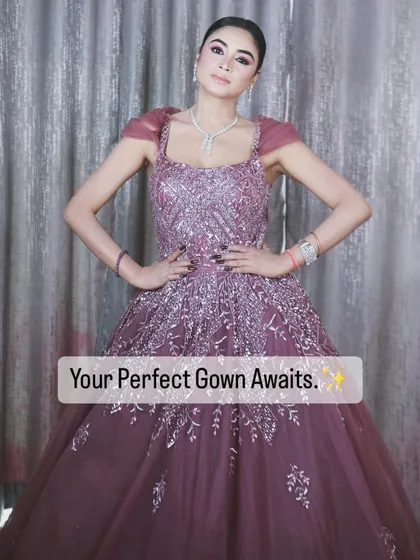 Your perfect gown awaits. This image captures the power and elegance of this stunning mauve-purple creation.