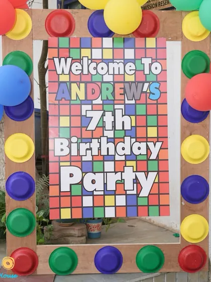 Welcome to Andrew's 7th birthday party with a fun Rubik's cube and primary color theme. We create personalized welcome signs and photo frames to make your event unique from the moment guests arrive.