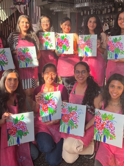 A sunny afternoon workshop where participants painted vibrant floral abstract bouquets. The cafe setting provides a relaxed and inspiring atmosphere for creativity.