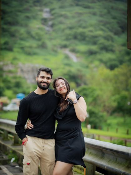 A relaxed pose during our outdoor pre-wedding session. The natural background and their comfortable body language make this shot feel authentic and effortless.