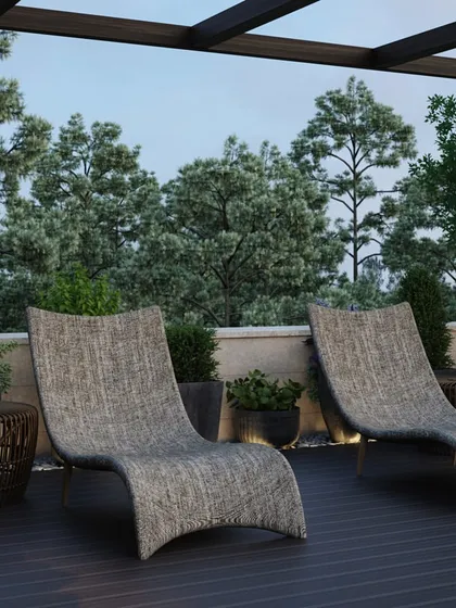 This area of the terrace is dedicated to sunbathing and lounging, with a row of ergonomic woven chaise lounges. The design ensures an open and uncluttered space, perfect for enjoying the sun with a backdrop of trees.