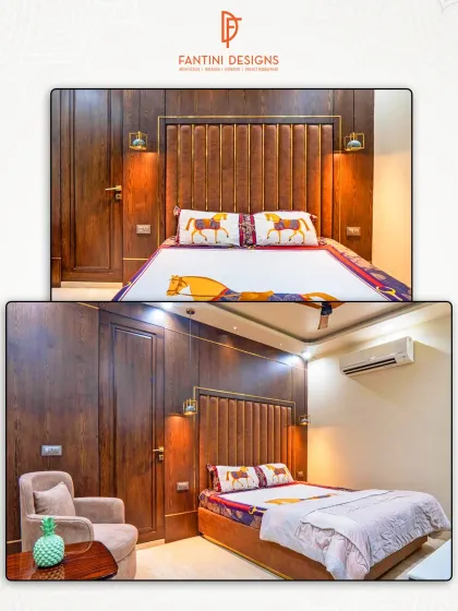 This bedroom combines a rich wood and leather-paneled headboard with warm lighting and a cozy armchair, creating a classic and comfortable retreat.