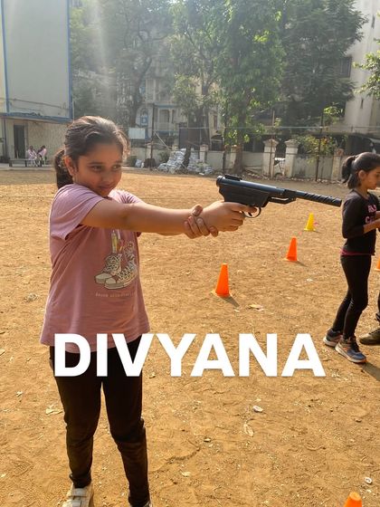 Divyana demonstrates the focus she learned during our marksmanship training session.