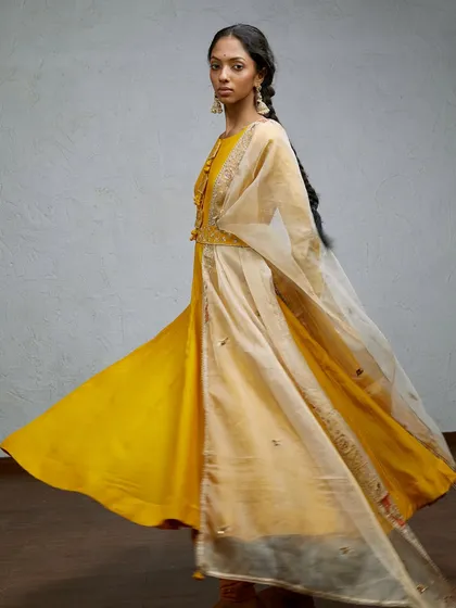 Fashion is poetry in motion. For this shot, I wanted to capture the graceful movement of the fabric as the model turns. The flowing silhouette of this yellow ethnic dress comes alive, showcasing the design in a dynamic and joyful way that tells a story beyond a static pose.