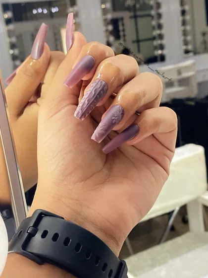 Get cozy with a 3D sweater nail design. This textured effect is created with acrylic powder over a matte polish, perfectly mimicking the look of a knitted sweater.