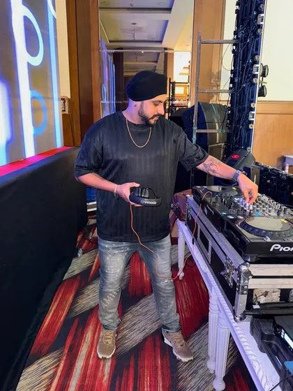 A close-up of me at my Pioneer console during a cocktail night. I use top-of-the-line equipment to ensure the best sound quality.