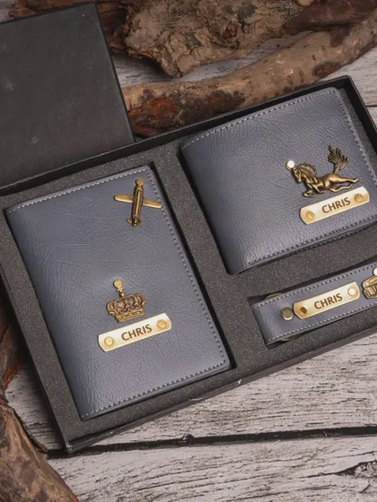 This personalized men's essentials kit is a popular choice for birthdays and special occasions. It features a wallet, passport cover, and keychain, all made from quality faux leather and customized with a name and a unique charm.