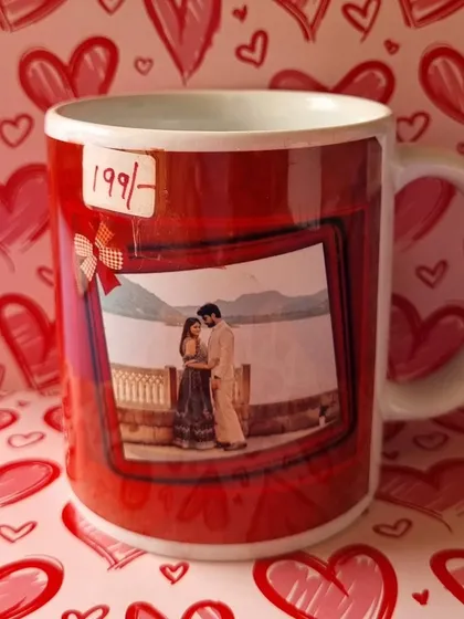 A custom coffee mug featuring a romantic couple's photo in a polaroid-style design, perfect as a small gift or an add-on.