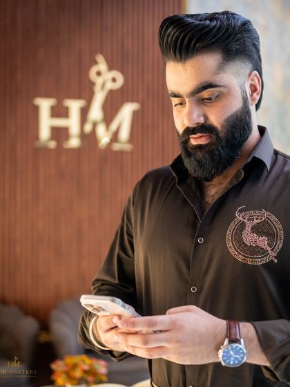 Craftsmanship in every detail. This client's haircut and beard trim are perfectly executed, reflecting our commitment to premium grooming.