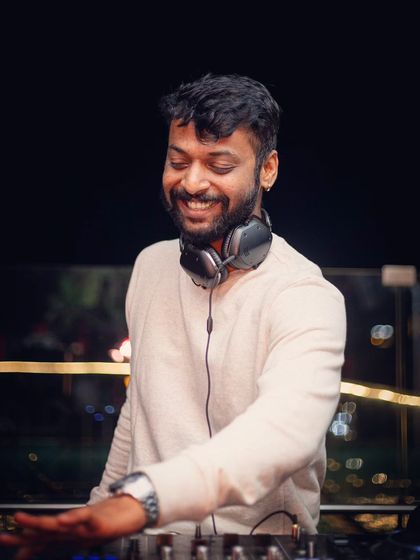 A simple portrait from behind the decks. Keep smiling and make it amazing.