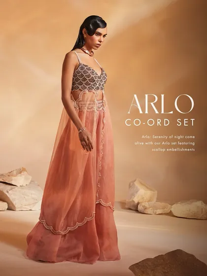 The Arlo Co-ord Set comes alive with scallop embellishments and pearl detailing. I designed this set with a unique layered silhouette for a serene yet striking effect.