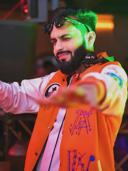 From the console to the crowd, I bring the chaos in style. This is me in my element, ready to get the party started with some desi beats.