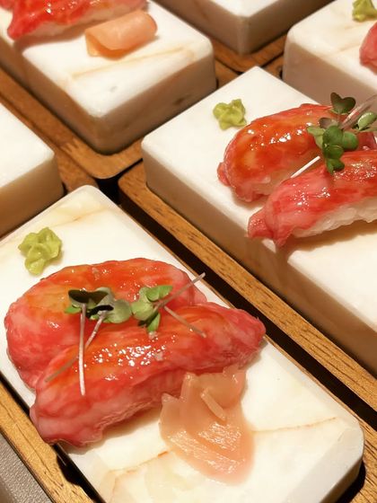 A dish that celebrates luxury. This is A5 Japanese Wagyu Nigiri, lightly seared and glazed with Tamari, then topped with Osetra Caviar and mustard cress for a buttery, melt-in-your-mouth experience.