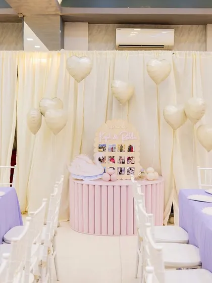 A view of the adult dining area at the princess party, with a special photo memory table set up for the birthday girl's mother.