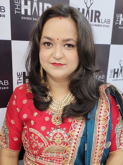 This client is glowing and ready for the party. I gave her soft, face-framing hair layers and makeup that highlights her features, paired with her embroidered outfit.