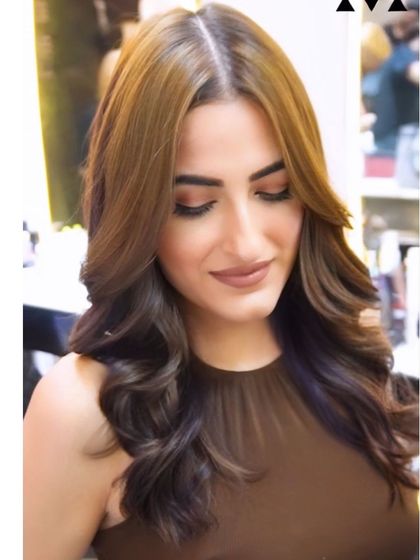 The final look of this beautiful hair transformation. The color is rich, the style is flawless, and the client is glowing.