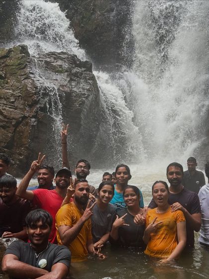 Our group having a blast, swimming and posing in a natural pool at Bandaje.