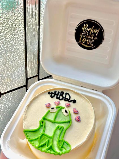 A Kermit the Frog meme bento cake, because who doesn't love a good meme? This is one of our favorite cheeky designs to create.