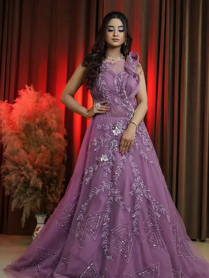 Another angle of the gorgeous onion pink gown, showing off its flattering A-line silhouette. This piece is available to rent, buy, or customize in your preferred color.