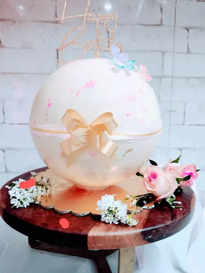 A cake full of surprises. Our Pinata Cake is a chocolate sphere that you break open with a small hammer to reveal a delicious cake and other treats inside.