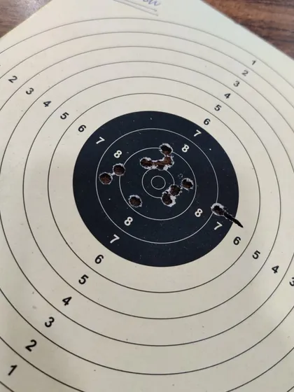 A close-up of Hitesh's target. Even with shots outside the center, the grouping provides valuable information for me to refine his technique.