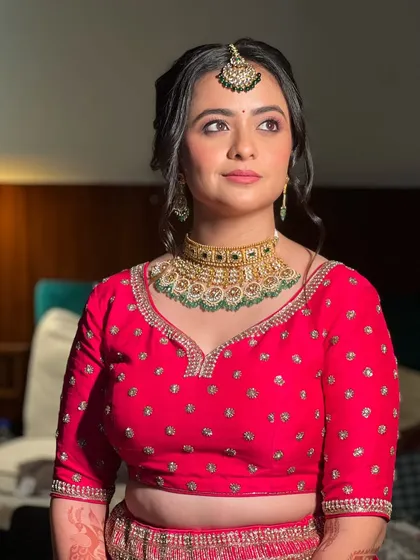 A perfectly lit shot showing the details of the makeup and the elegant, understated hairstyle.