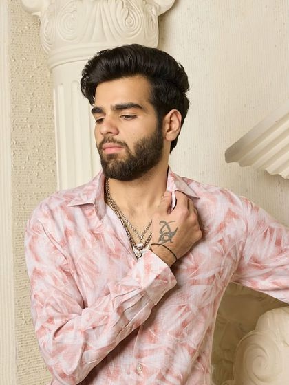 A close-up of the pink abstract shirt, focusing on the texture of the fabric and the subtle details that make it a standout piece for any occasion.