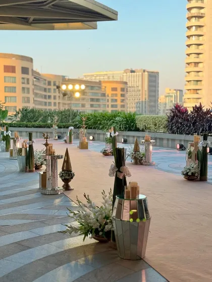 More angles from the super chic rooftop celebration in Mumbai. The decor combines modern elements with classic florals, all set against a stunning city skyline.