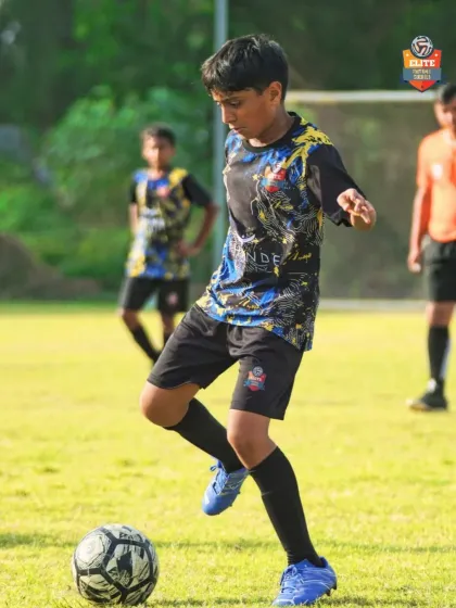 Dribbling with precision. This player shows the close control we emphasize in our technical sessions.