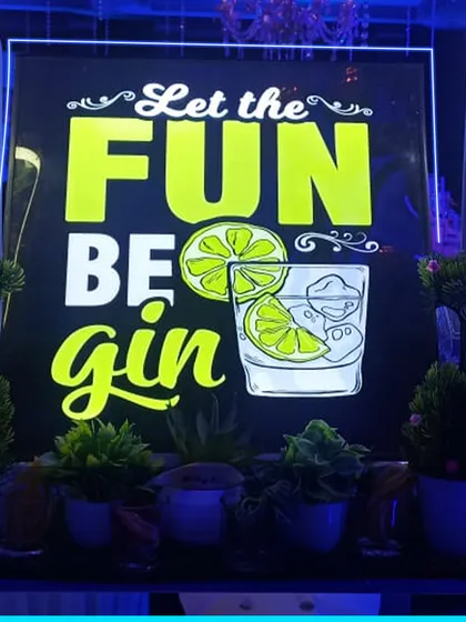 "Let the Fun Be-gin" is one of our favorite signs for a gin-centric bar setup. It's a playful way to highlight a specific spirit or theme for your party.