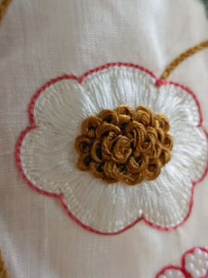 A close-up of the beautiful French knot embroidery on our linen co-ord set, showcasing the detailed craftsmanship.