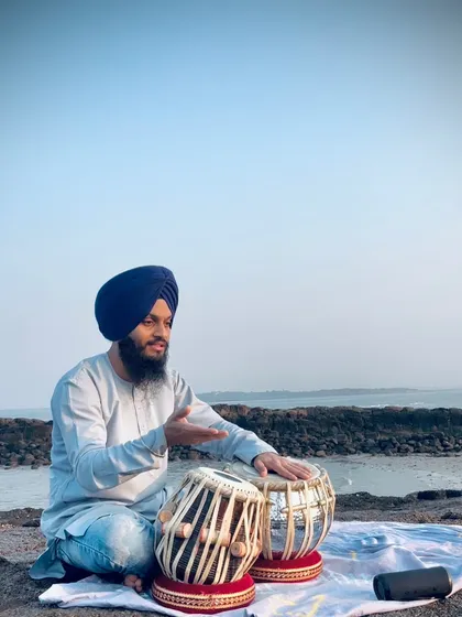 Explaining a rhythmic concept or 'bol' during my outdoor practice session.