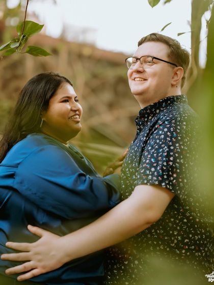 A happy, natural moment between a couple amidst lush greenery. I find quiet corners even in bustling cities to capture your connection.
