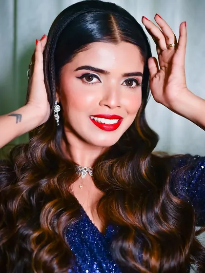 A bright, happy smile that shows how the makeup looks when expressing joy. The look is both sophisticated and approachable.