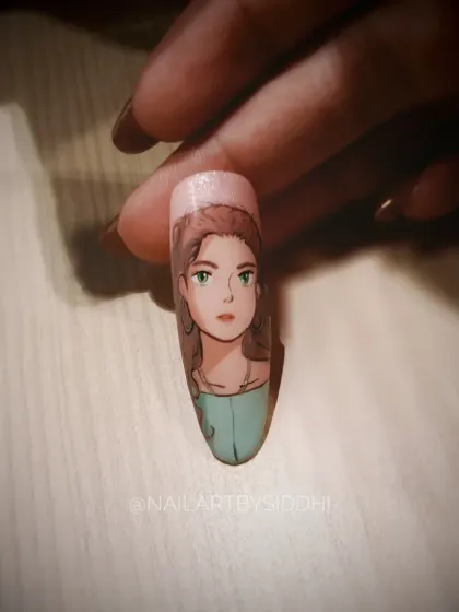 A delicate hand-painted anime-style portrait on a single nail, showing my versatility in different character art styles.
