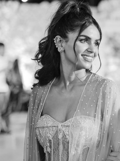 A close-up of the mehendi look, showing the intricate details of the gown and the modern ear cuffs. It’s all about those small touches that make an outfit special.